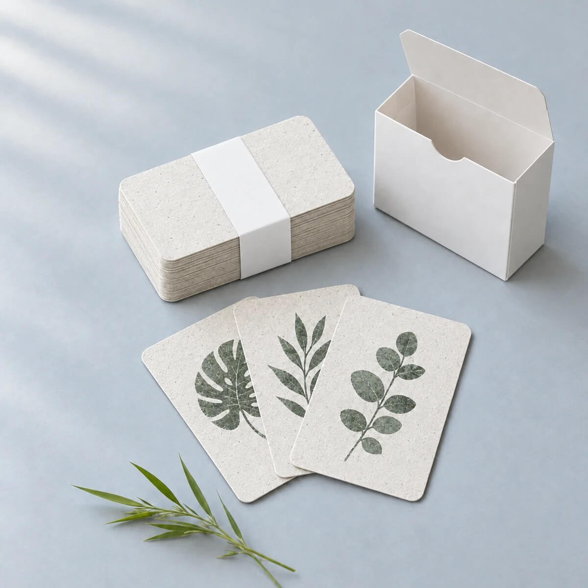 Botanical cards printed on EF27 plant-fiber card stock with a paper band and white tuck box